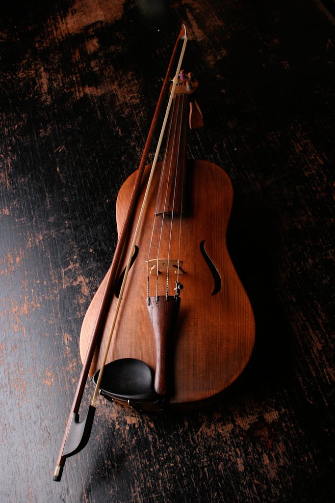 Brown Wooden Violin and Violin Bow